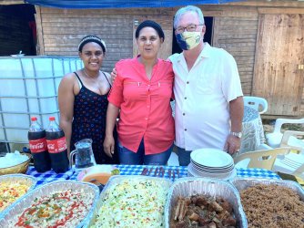 Tim with food and sisters.jpg Tim with food and sisters.jpg
